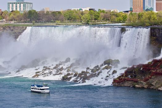 Beautiful photo of a ship near amazing Niagara waterfall