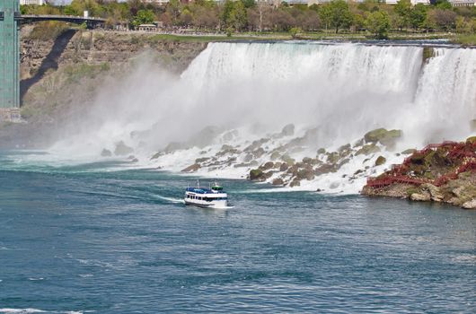 Beautiful photo of a ship near amazing Niagara waterfall