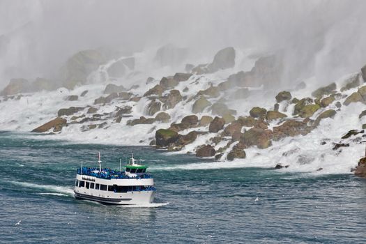 Beautiful photo of a ship near amazing Niagara waterfall