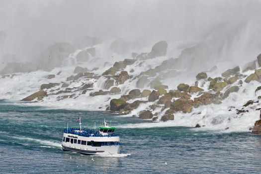 Beautiful photo of a ship near amazing Niagara waterfall