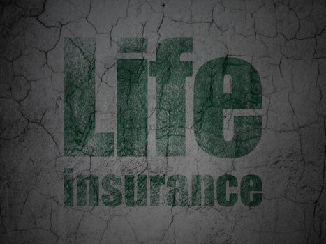 Insurance concept: Green Life Insurance on grunge textured concrete wall background