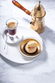 Almonds cookies and coffee on a table