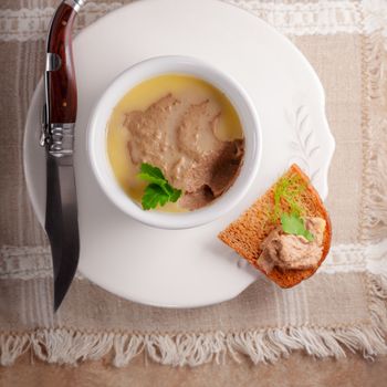 Home made chicken liver pate on a wooden surface