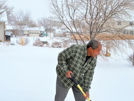 African american male in winter snow outdoors.