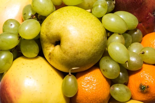 Colored fruits on table.