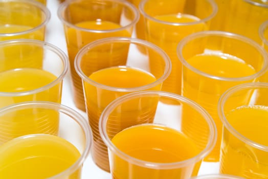Orange juice in a glass on white background