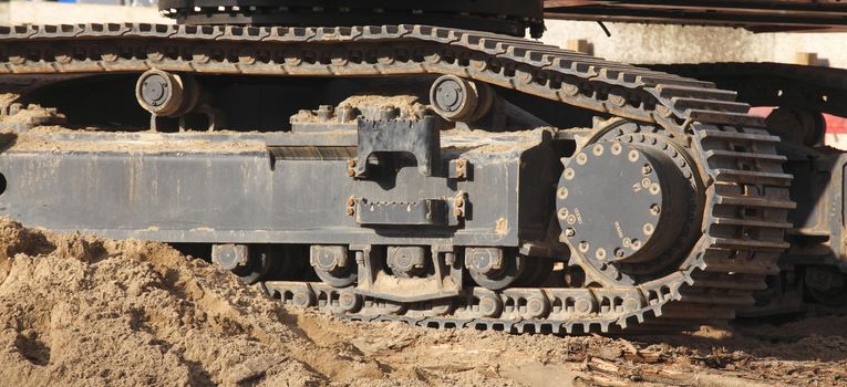 Chain Weels of an Excavator in the Sand