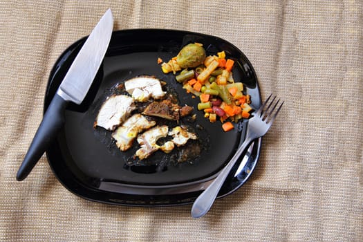 Grilled chicken fillet, breast with cooked vegetable on plate