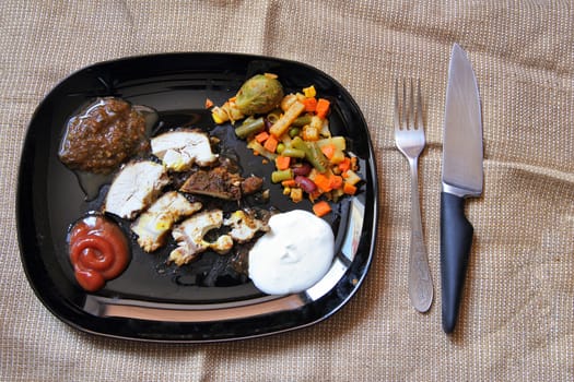 Grilled chicken fillet, breast with cooked vegetable on plate