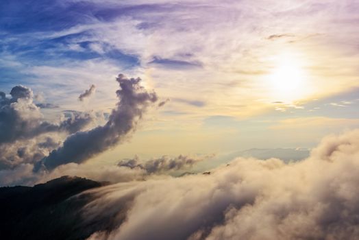 Beautiful landscape nature of high mountain colourful sunlight cloud and sky on Phi Pan Nam Range during sunset in winter from viewpoint Phu Chi Fa Forest Park at Chiang Rai Province Thailand