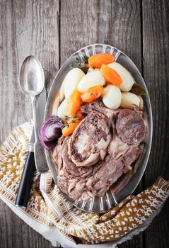 Pot-Au-Feu - French beef stew with a spoon and knife