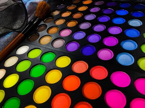 Fashion background  with Colorful makeup palette with makeup brush,color filter  