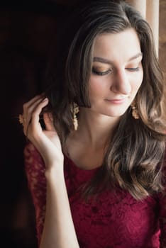 close-up portrait of a beautiful girl in red dress