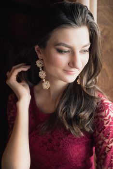 close-up portrait of a beautiful girl in red dress