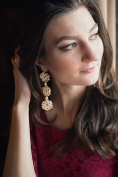 close-up portrait of a beautiful girl in red dress