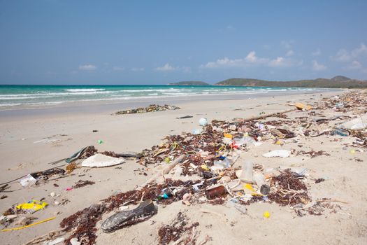 Lot of rubbish washed up on the shore on the beach