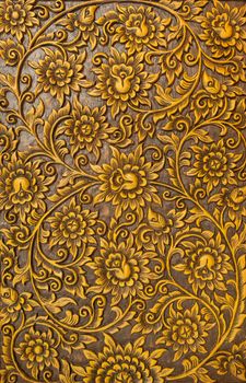 Pattern of flower carved on wood background