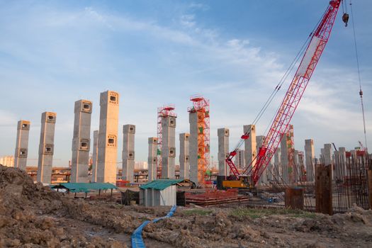 The construction site. Construction of the new building. Construction cranes.