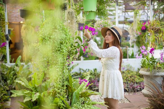 Beautiful young asian woman enjoying the freshness of a lone