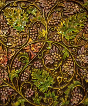 Pattern of flower carved on wood background