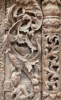 Old wood carvings on the wall temple in Myanmar