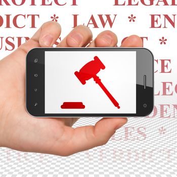 Law concept: Hand Holding Smartphone with  red Gavel icon on display,  Tag Cloud background, 3D rendering