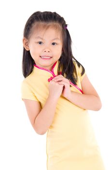 Chinese young girl in traditional Chinese cheongsam blessing, isolated on white background