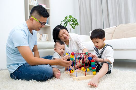 Asian family playing toys