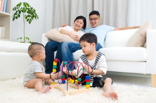 Asian family playing toys