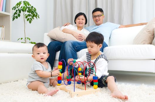 Asian family playing toys