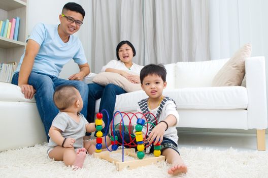 Asian family playing toys