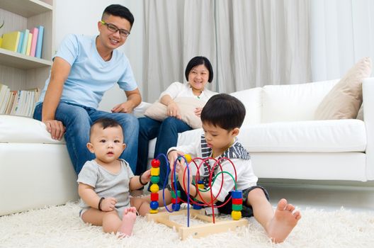 Asian family playing toys