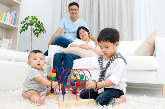 Asian family playing toys