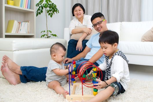 Asian family playing toys