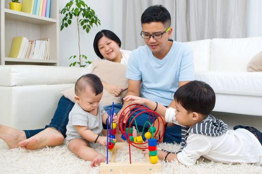 Asian family playing toys