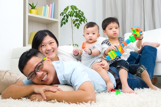 Asian family playing toys