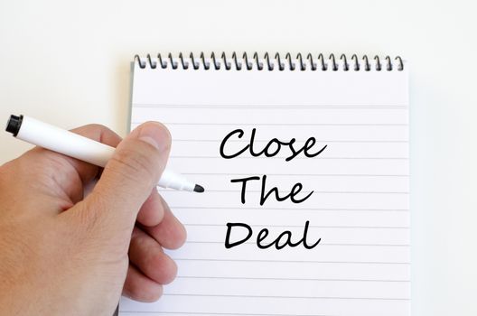 Close the deal text concept write on notebook