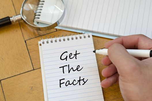 Get the facts text concept write on notebook