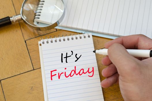 It's friday text concept write on notebook