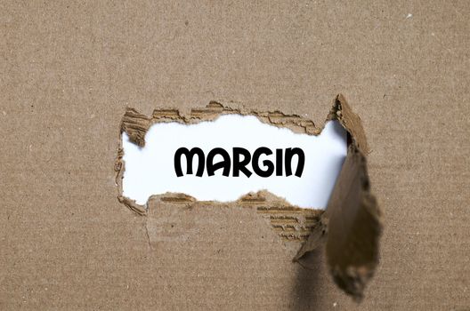 The word margin appearing behind torn paper