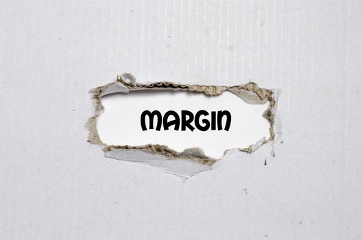 The word margin appearing behind torn paper