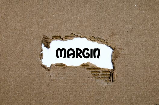 The word margin appearing behind torn paper