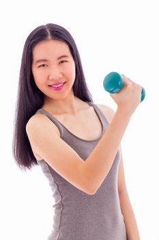 Chinese teenage girl lifting bumbbell, looking at camera