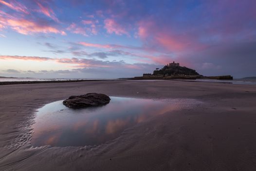 Rock on the beach in the foreground at St Michael's Mount, Marazion, west Cornwall