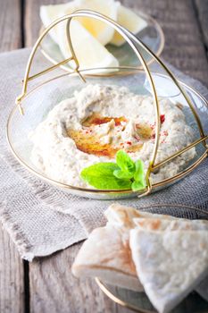 Baba ghanoush, eggplant dip, mediterranean food ona wooden surface