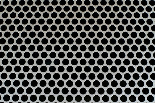 Metal surface background with holes