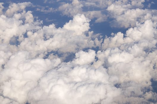 Clouds and sky high angle on the plane.