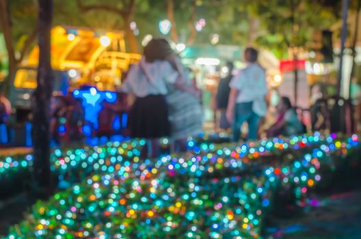 people blur Bokeh from the lights at night