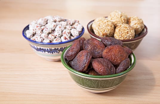 Oriental sweets in bowls on a table