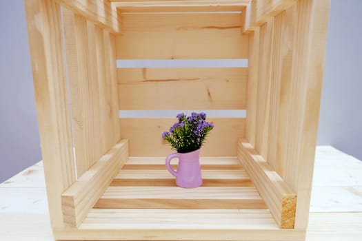 Wooden Box with Purple Little Flower in Pot